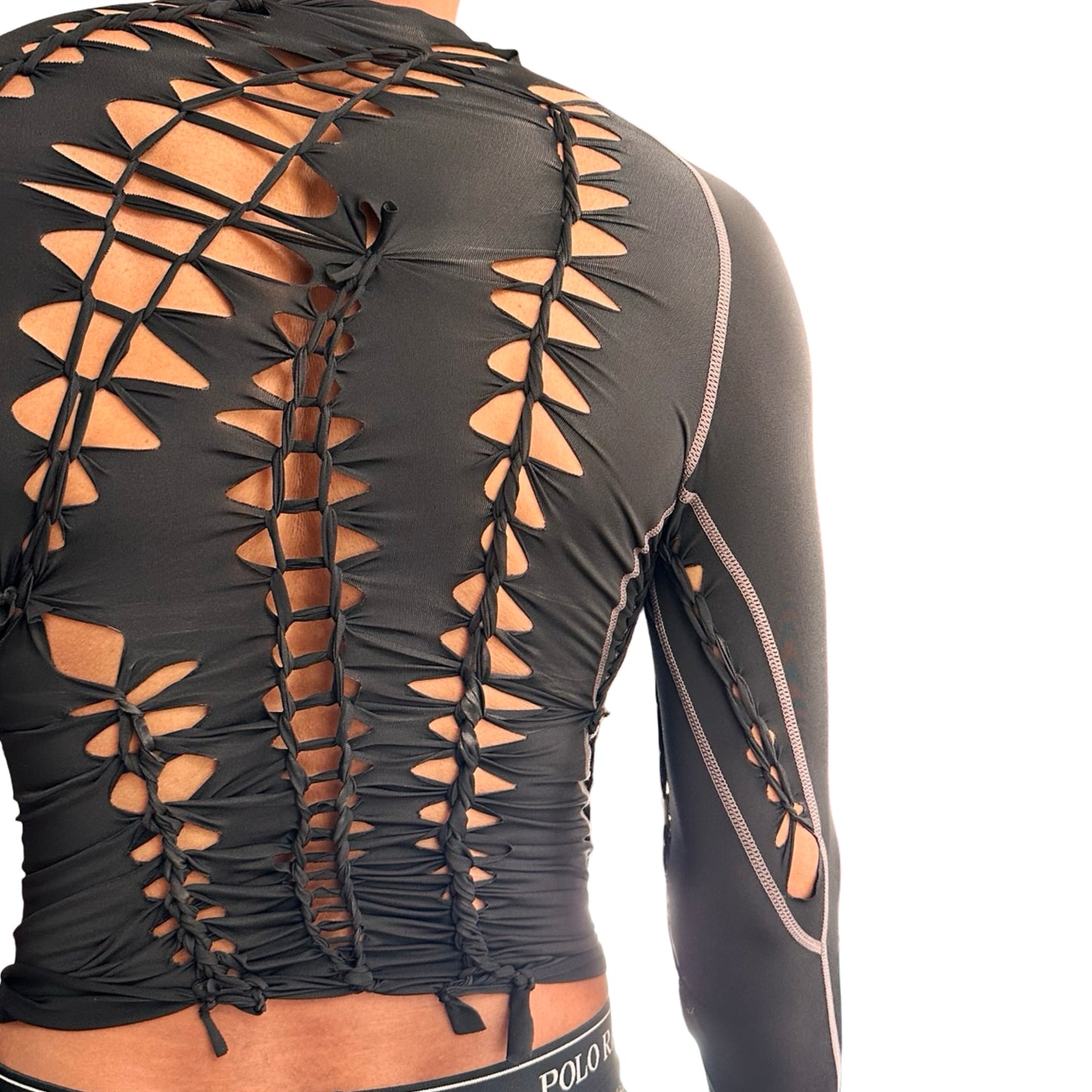 Back detail of ASTROBOI* 'Mystique' black braided twist compression top with cut-out details. Handmade in NYC using breathable, moisture-wicking stretch fabric.