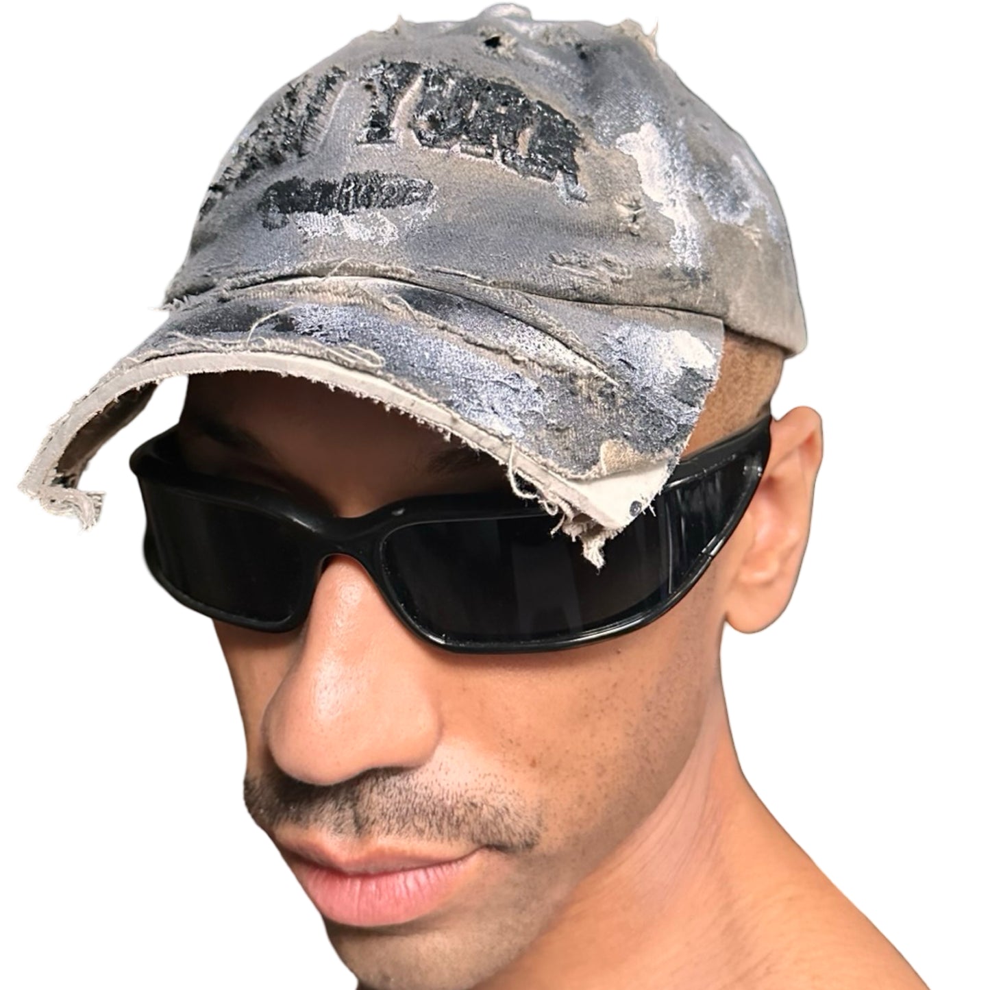 Front view of ASTROBOI* tan and black New York logo hat with distressed half visor and black and white paint detailing