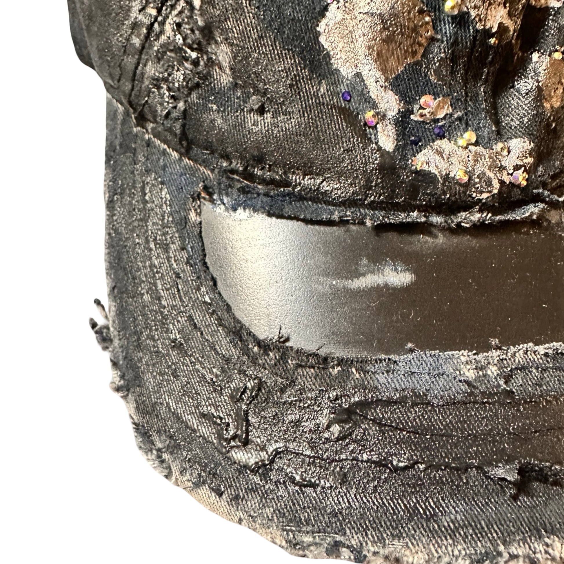 Close up of visor Black acid-washed denim hat with silver paint accents, multicolored rhinestones, and a ripped visor seam, customized by ASTROBOI* STUDIO.