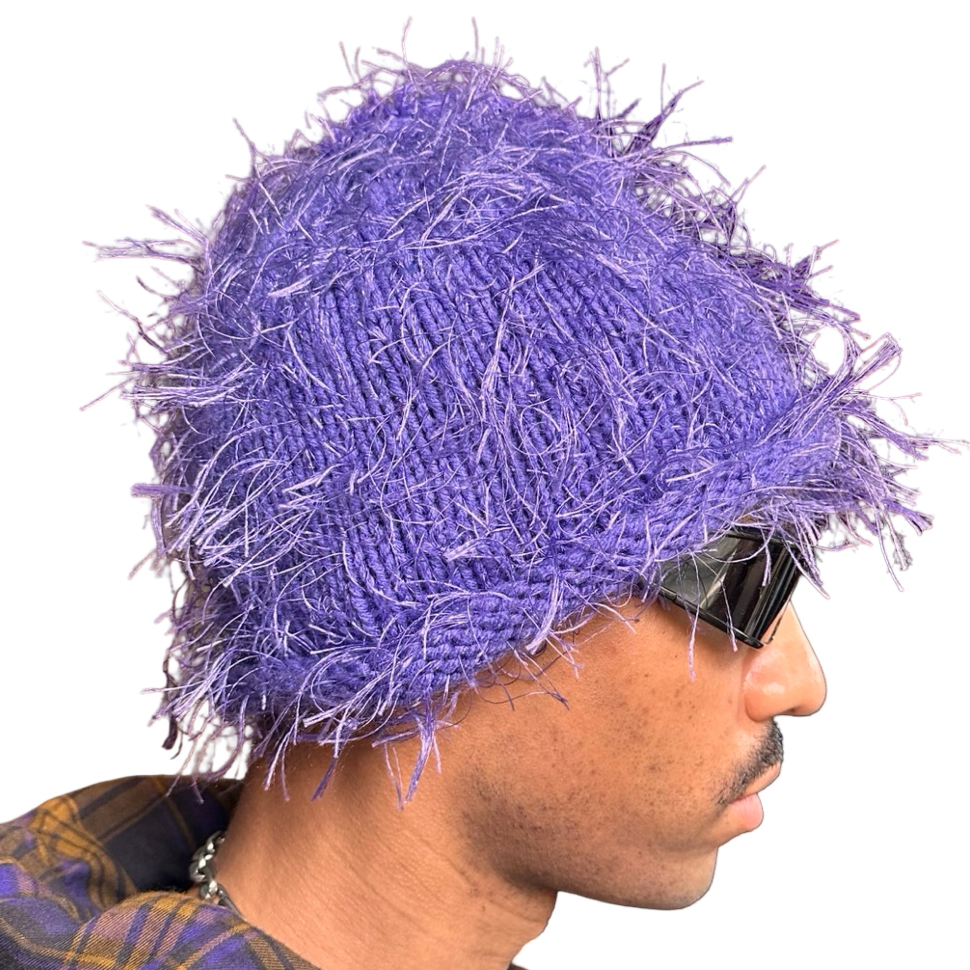 Right side of Lavender purple eyelash-yarn knit beanie with rolled edges and a soft, textured silhouette. Stretchy, cozy winter hat.