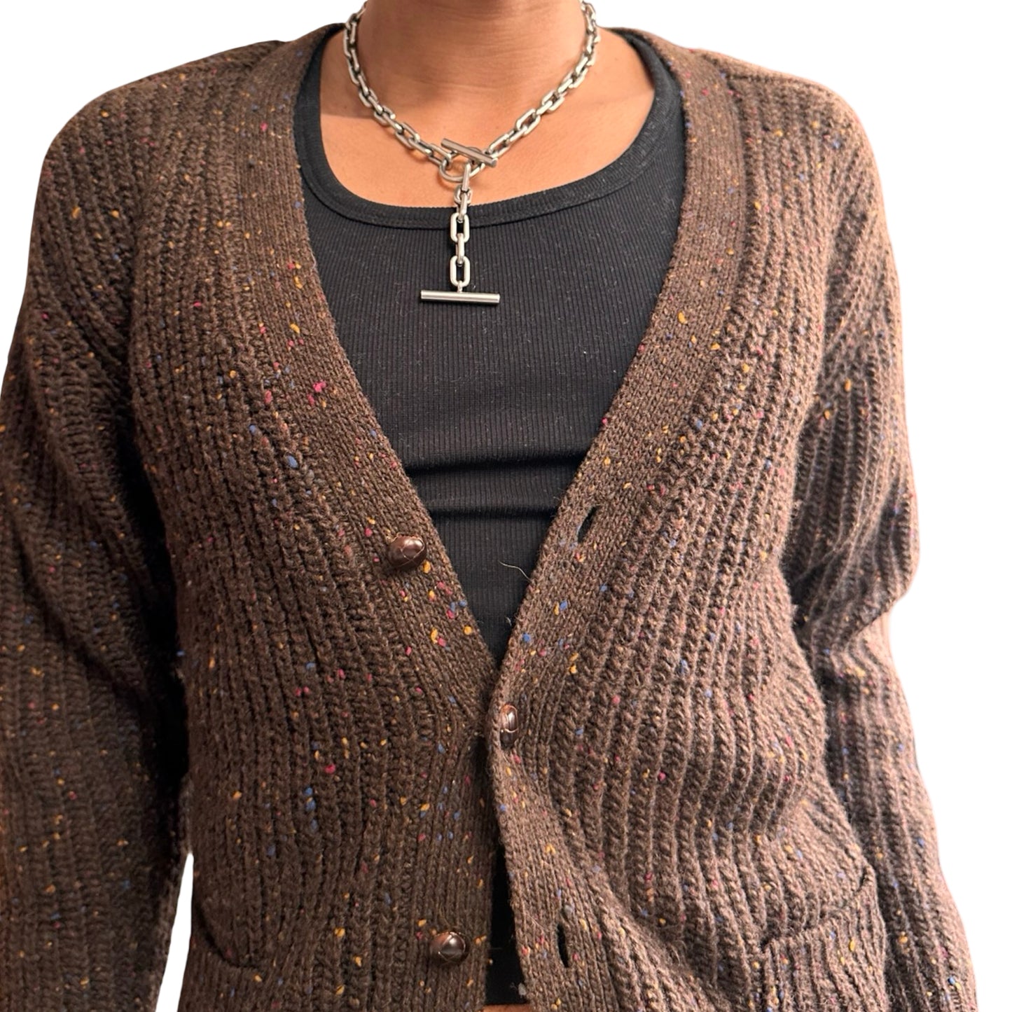 Brown knitted cardigan worn by a person on a white background