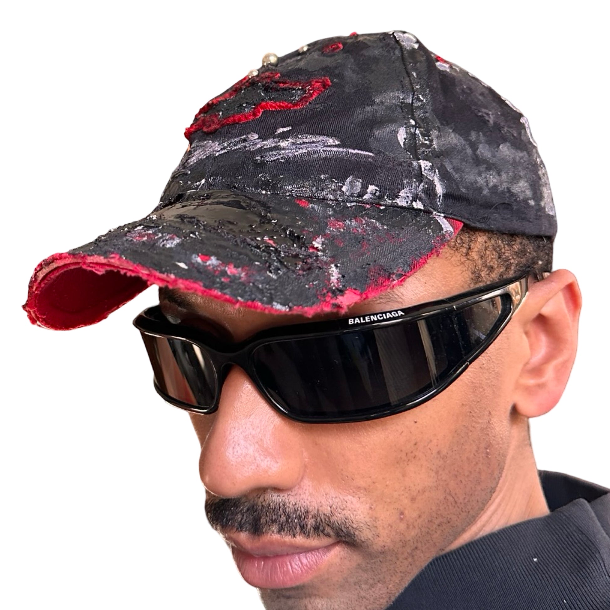 Front left of Black and red Chevy Racing hat customized by ASTROBOI* with distressing, painted details, glossy resin visor, and stainless steel piercings.