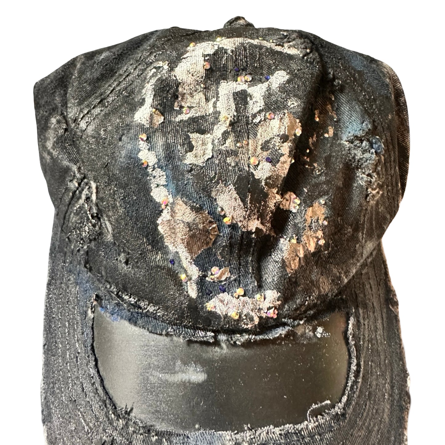 Front close up of Black acid-washed denim hat with silver paint accents, multicolored rhinestones, and a ripped visor seam, customized by ASTROBOI* STUDIO.
