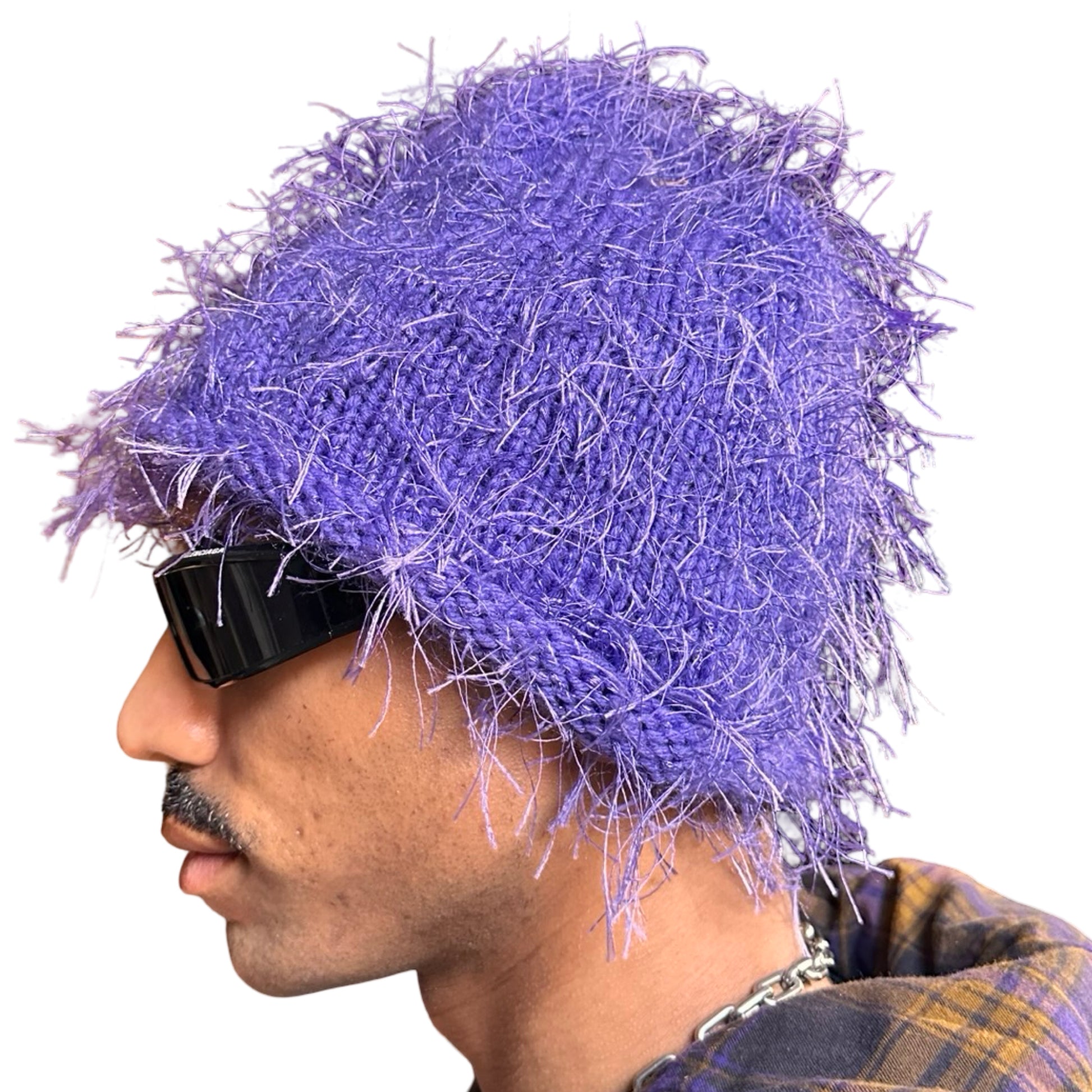 Left side of Lavender purple eyelash-yarn knit beanie with rolled edges and a soft, textured silhouette. Stretchy, cozy winter hat.