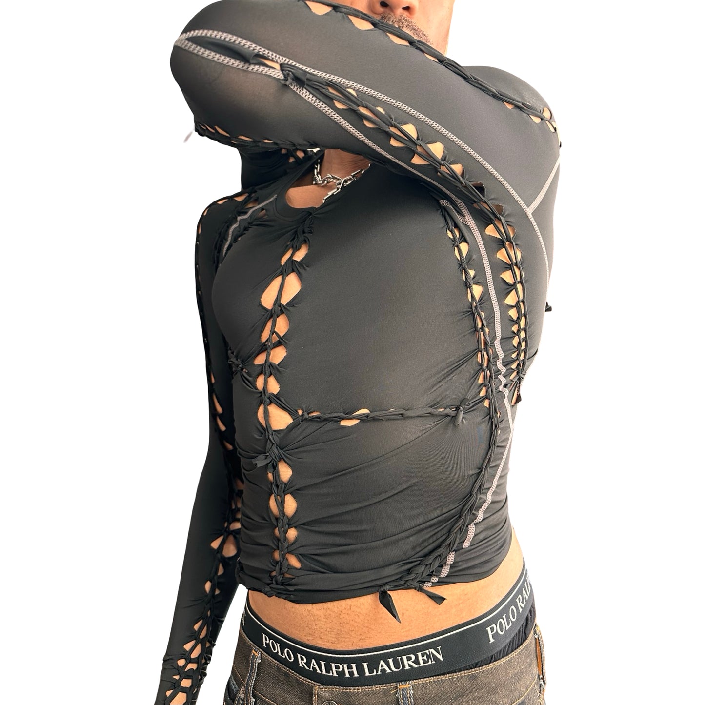 Right side detail 2 of ASTROBOI* 'Mystique' black braided twist compression top with cut-out details. Handmade in NYC using breathable, moisture-wicking stretch fabric.