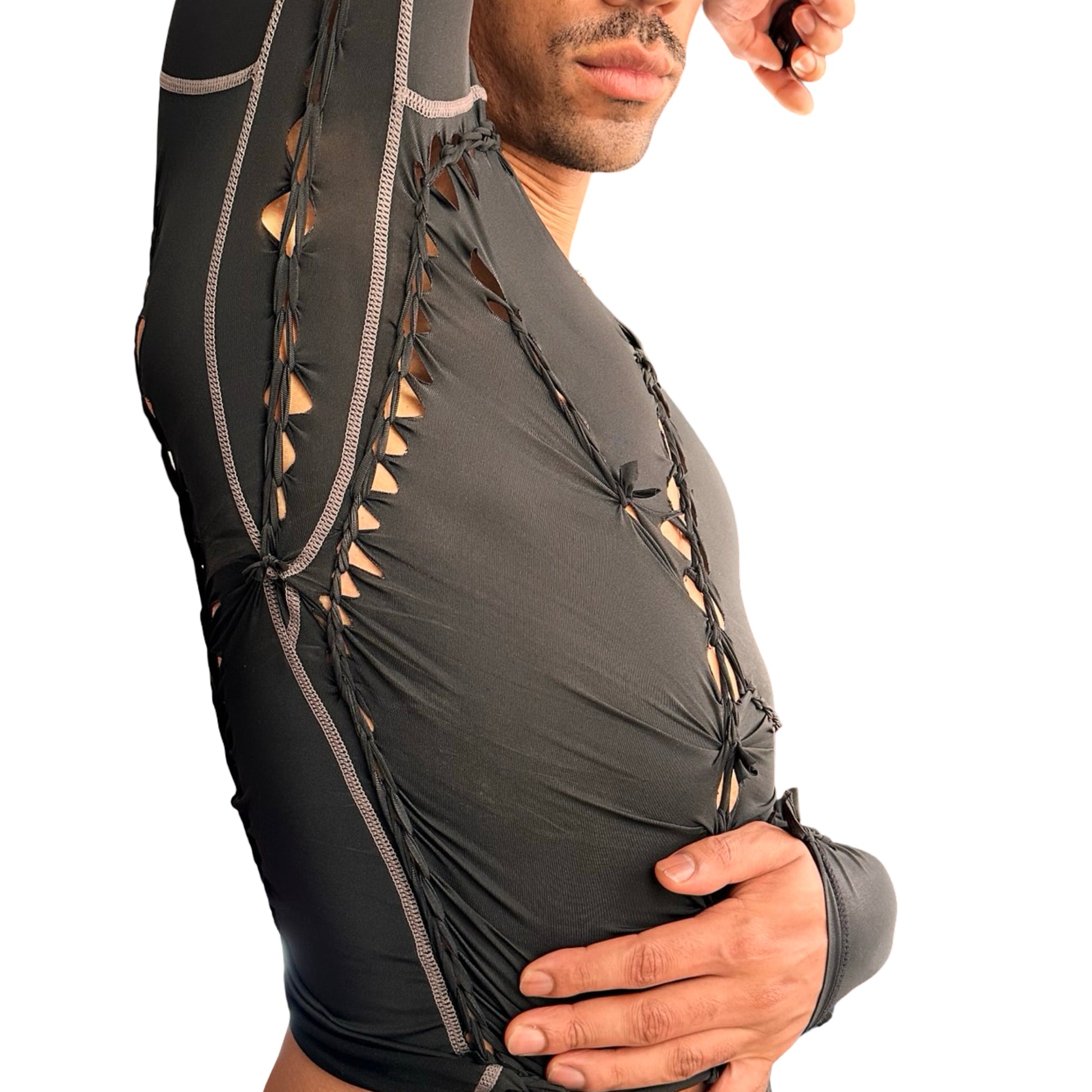 Left side detail of ASTROBOI* 'Mystique' black braided twist compression top with cut-out details. Handmade in NYC using breathable, moisture-wicking stretch fabric.