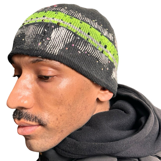 Front left of ASTROBOI* grey beanie with slime green stripe, iridescent metallic paint, and multicolored rhinestones. Custom NYC-made Y2K streetwear accessory.