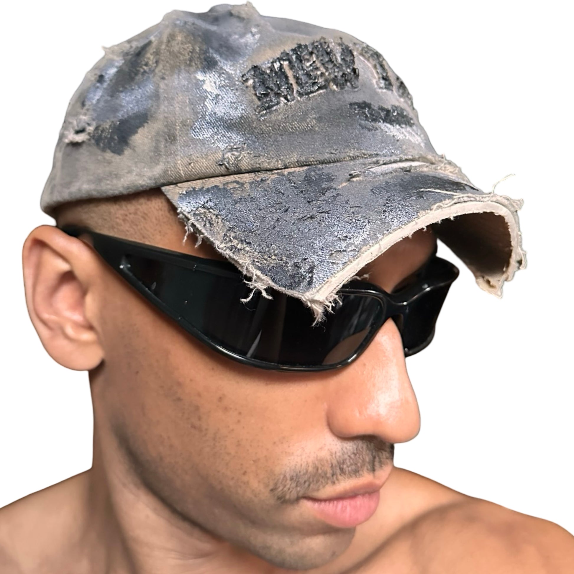 Right view of ASTROBOI* tan and black New York logo hat with distressed half visor and black and white paint detailing.