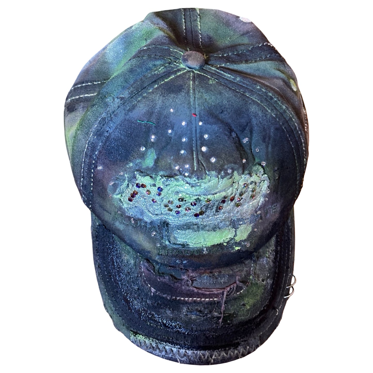 Flat top image of “Green and brown distressed ASTROBOI* Hawaii hat with rhinestones, metallic paint, and sterling-steel piercings, customized in NYC.”