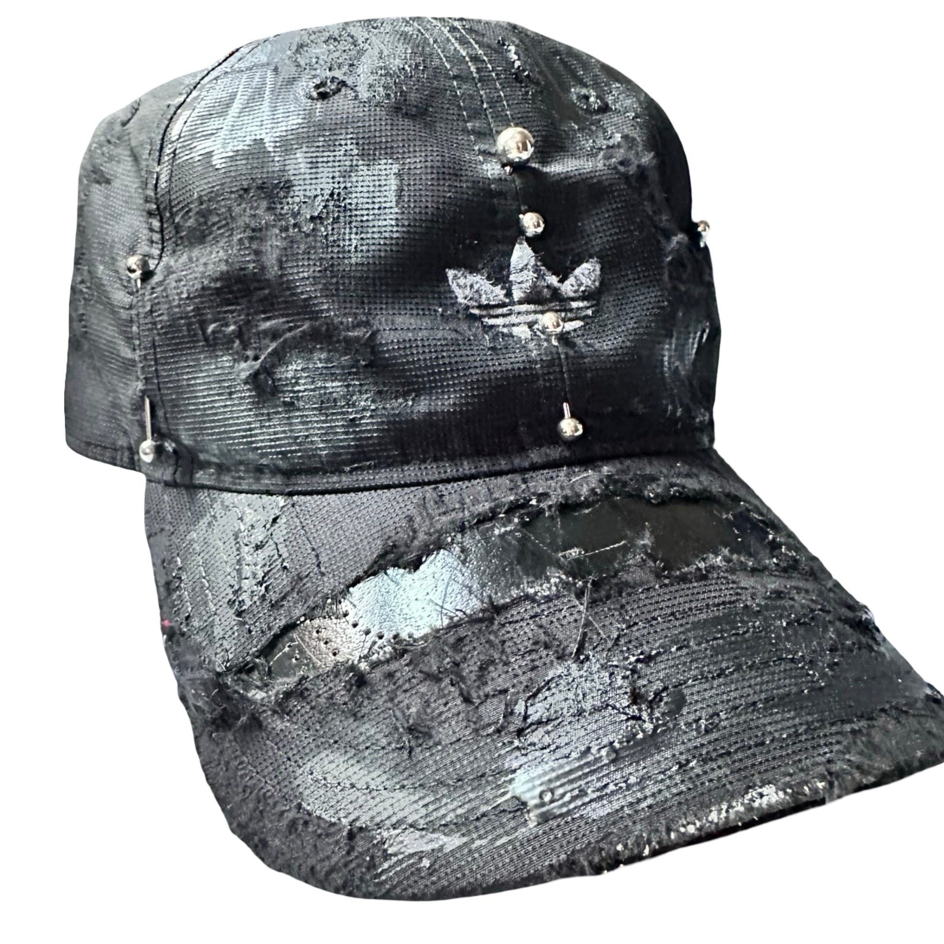 Flat front right side of Black Adidas hat customized by ASTROBOI* with distressing, black painted accents, and stainless steel piercings.