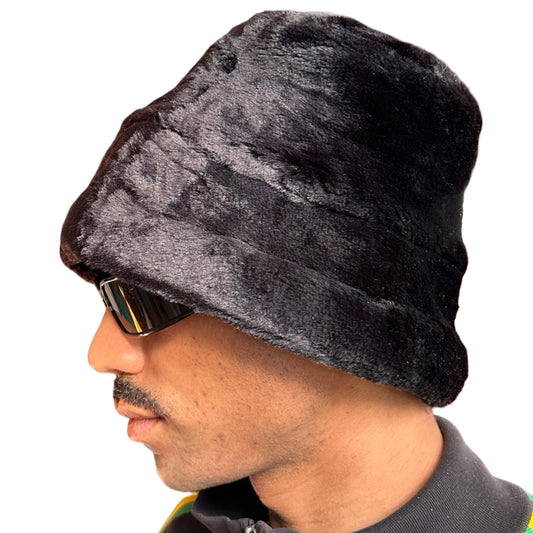 Left of Vintage black faux fur winter bucket hat with cone-shaped silhouette and insulating polyester fabric.