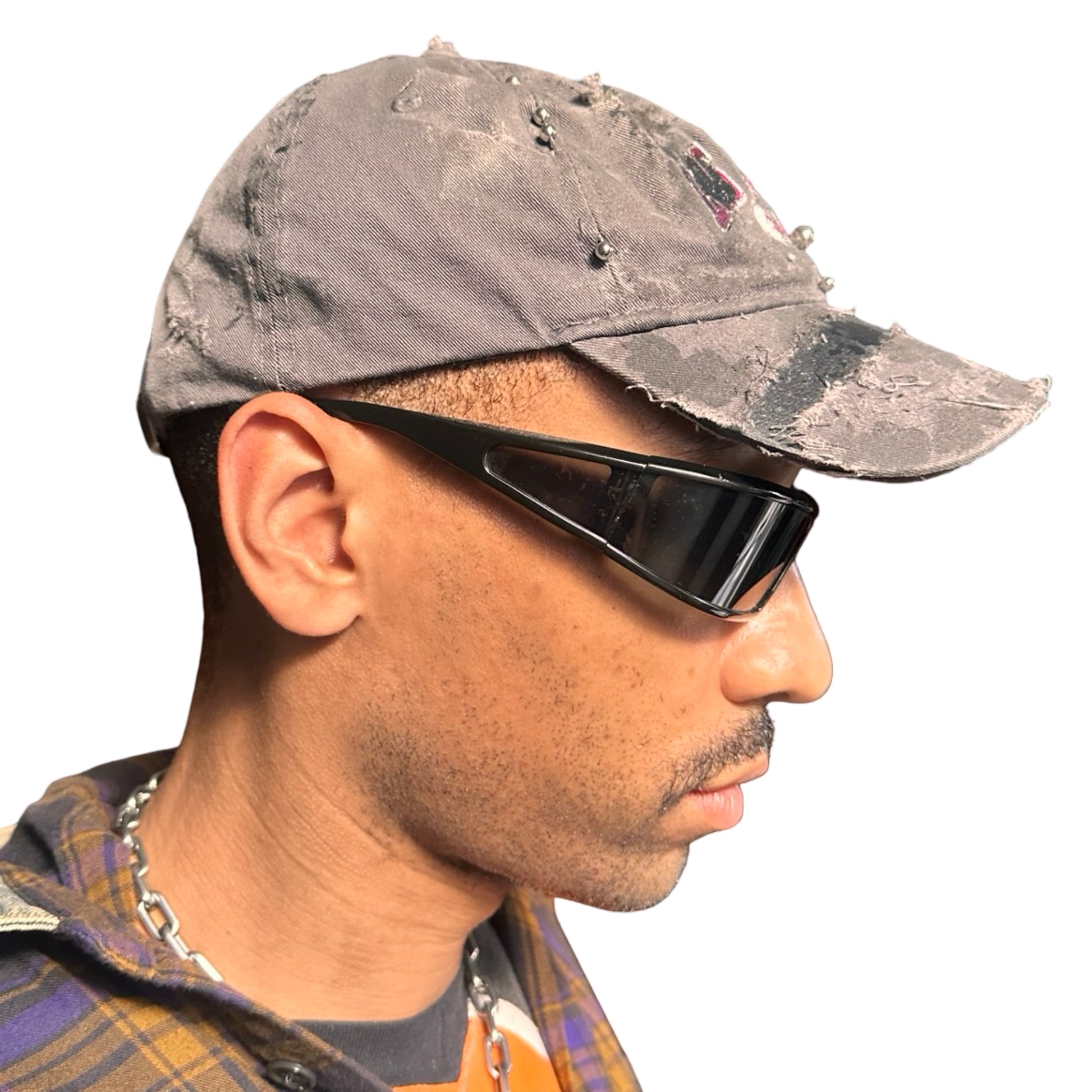 Right side of Grey and pink distressed half-visor hat with ‘Los Angeles’ embroidery, black paint, and stainless steel piercings, customized by ASTROBOI*.