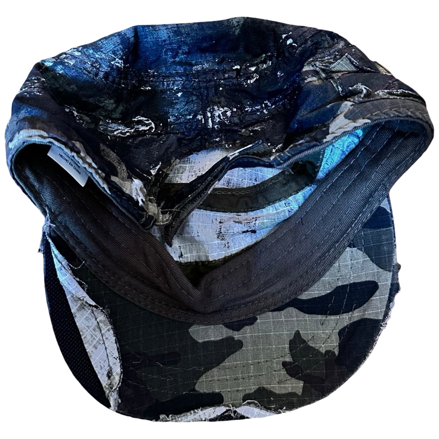 Flat back of Distressed retro green camouflage hat with hand-painted details and side coin pocket, customized by ASTROBOI* STUDIO in NYC.