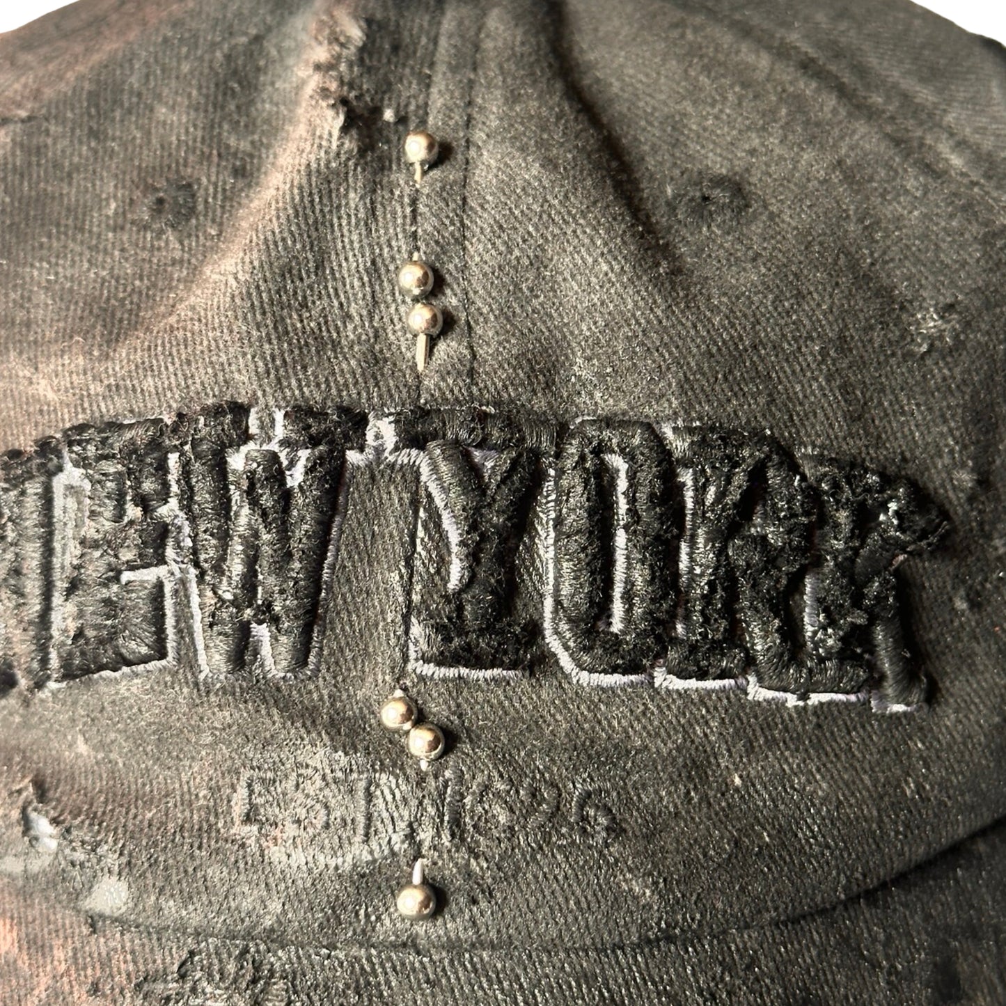 ASTROBOI* 'Kinky' New York Black Distressed Pierced Half Visor Hat - flat front detail 