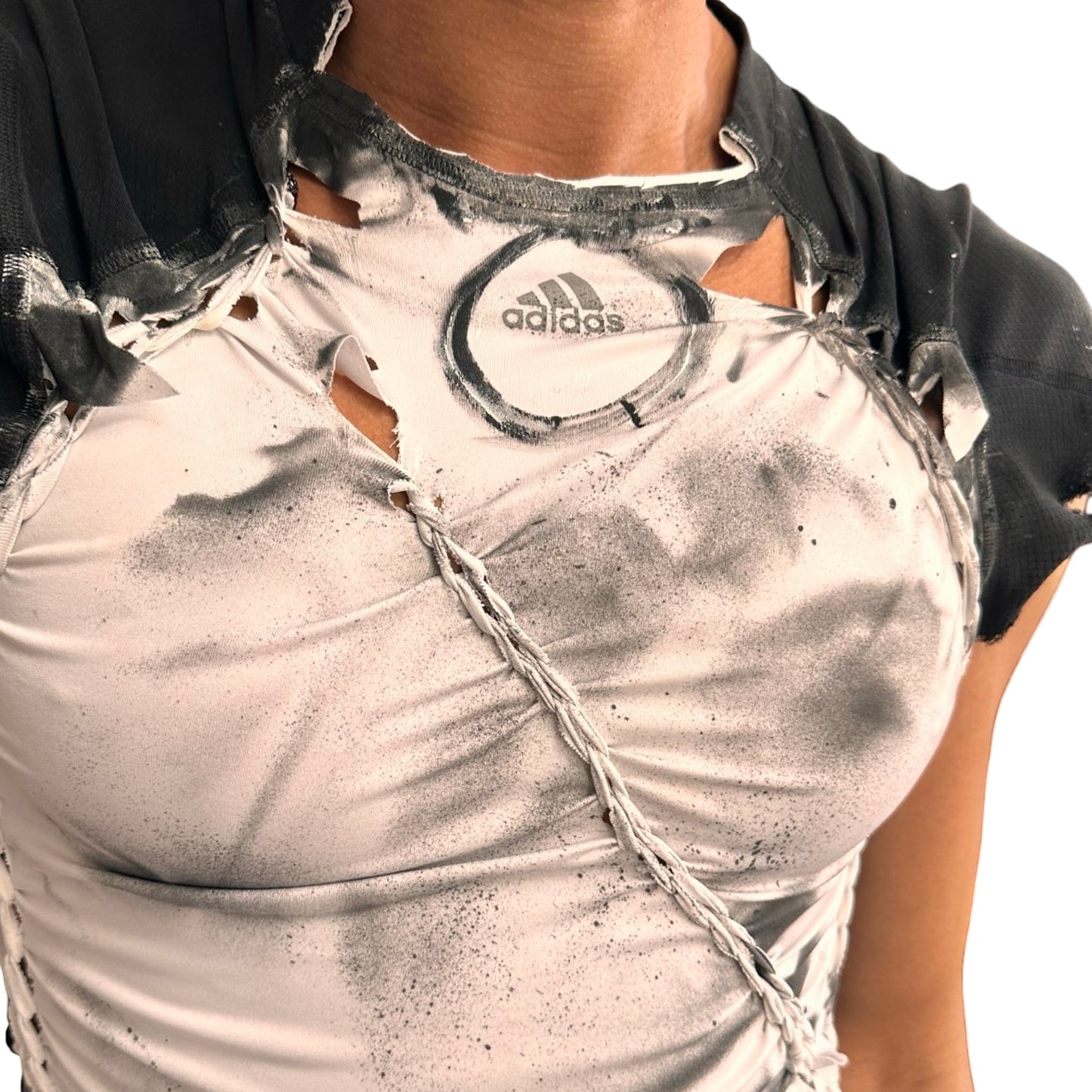 Close up of logo ASTROBOI* x Adidas white compression T-shirt with black hand-painted details and braided twists. Custom streetwear piece made in NYC by ASTROBOI* STUDIO.