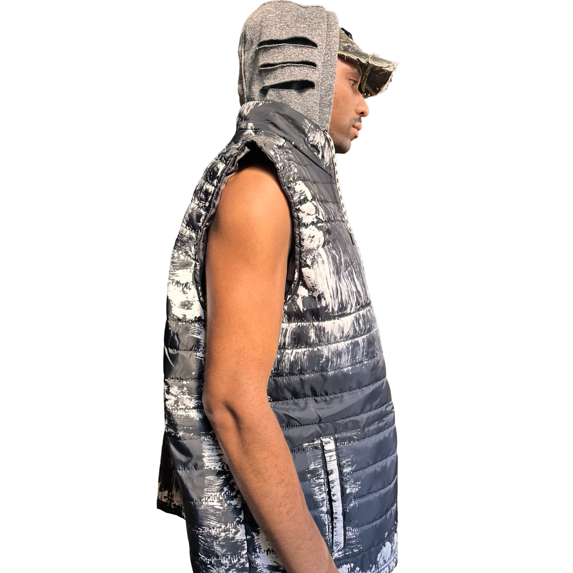 ASTROBOI* x Ecko Unltd black painted puffer vest with oversized gray hood, reflective logo, and white paint-stroke detailing. Custom streetwear made in NYC. Hood up right side 