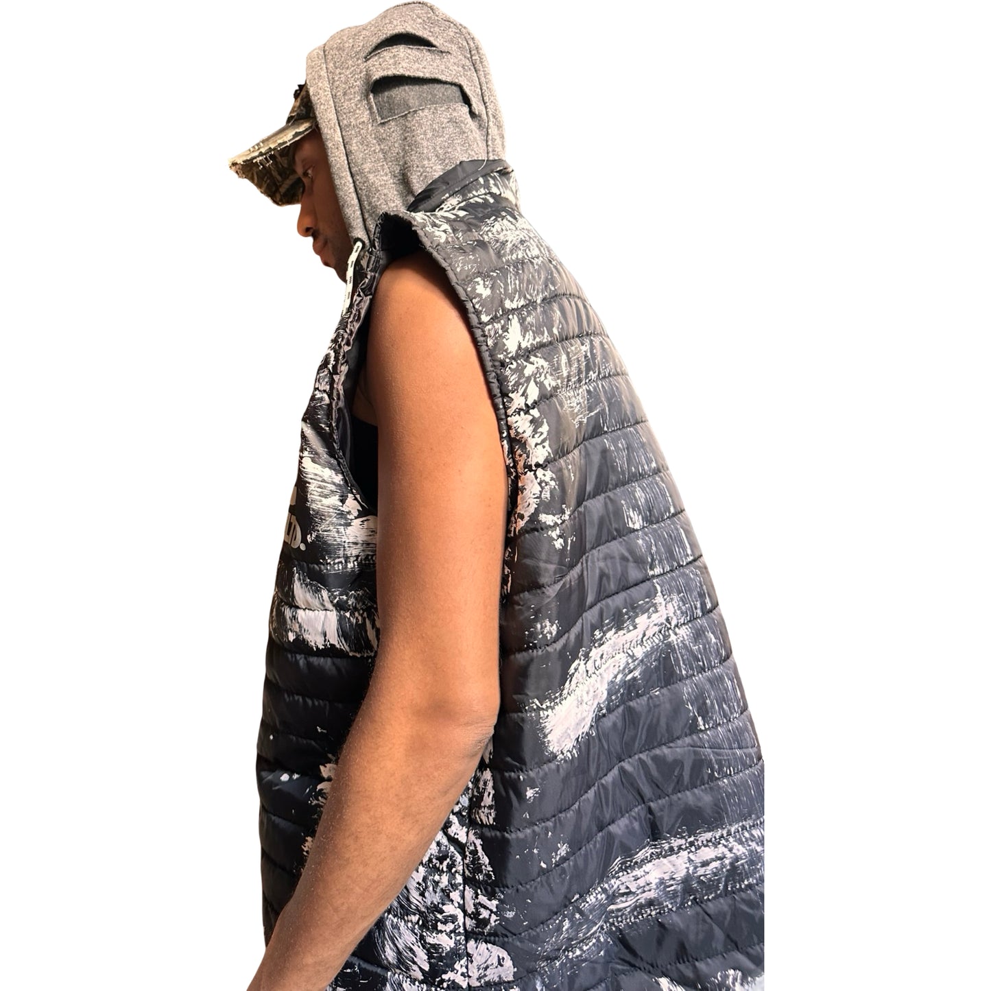 ASTROBOI* x Ecko Unltd black painted puffer vest with oversized gray hood, reflective logo, and white paint-stroke detailing. Custom streetwear made in NYC. Hood up left side 