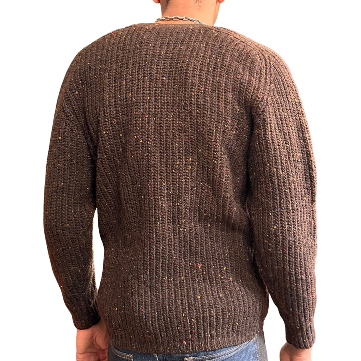 Brown knitted sweater worn by a person on a white background
