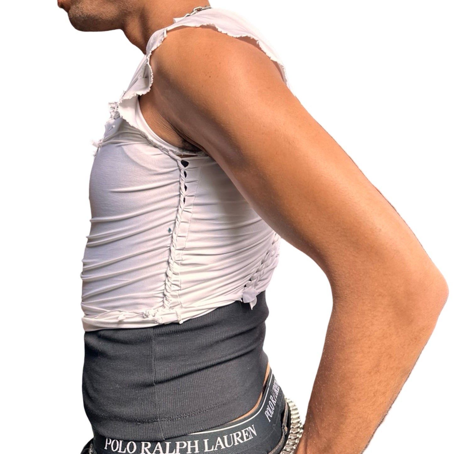 Left side of ASTROBOI* x O’NEIL white braided compression top with deconstructed logo, front body braids, and slim fit. Handmade in Brooklyn with UPF 50+ fabric.