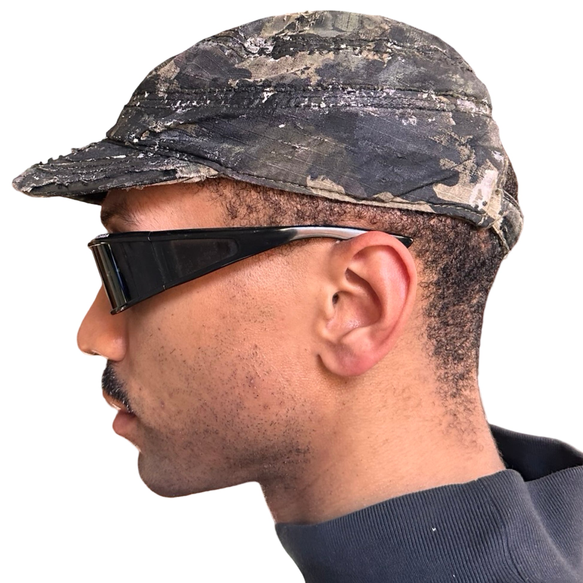 Left of Distressed retro green camouflage hat with hand-painted details and side coin pocket, customized by ASTROBOI* STUDIO in NYC.