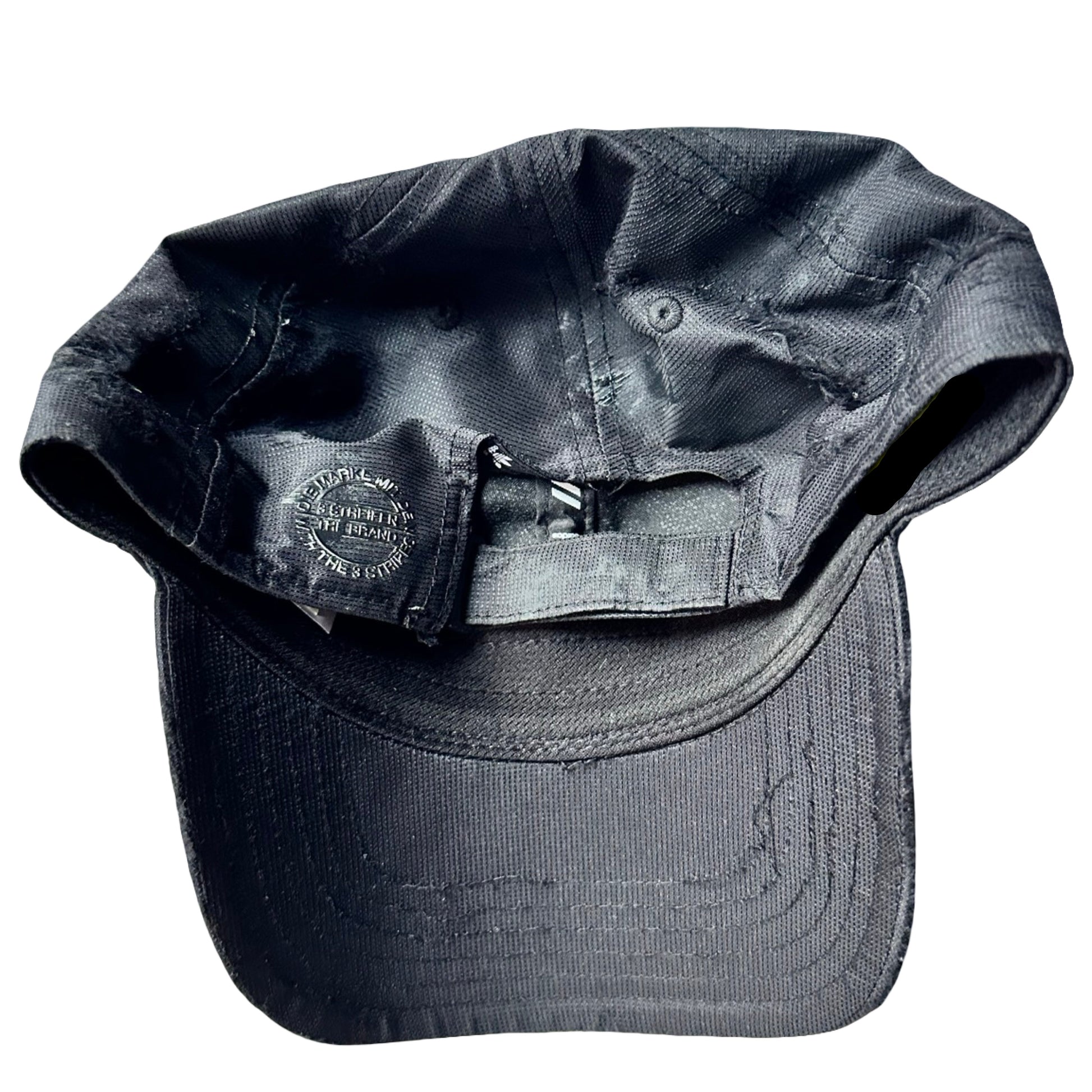 Flat back of Black Adidas hat customized by ASTROBOI* with distressing, black painted accents, and stainless steel piercings.