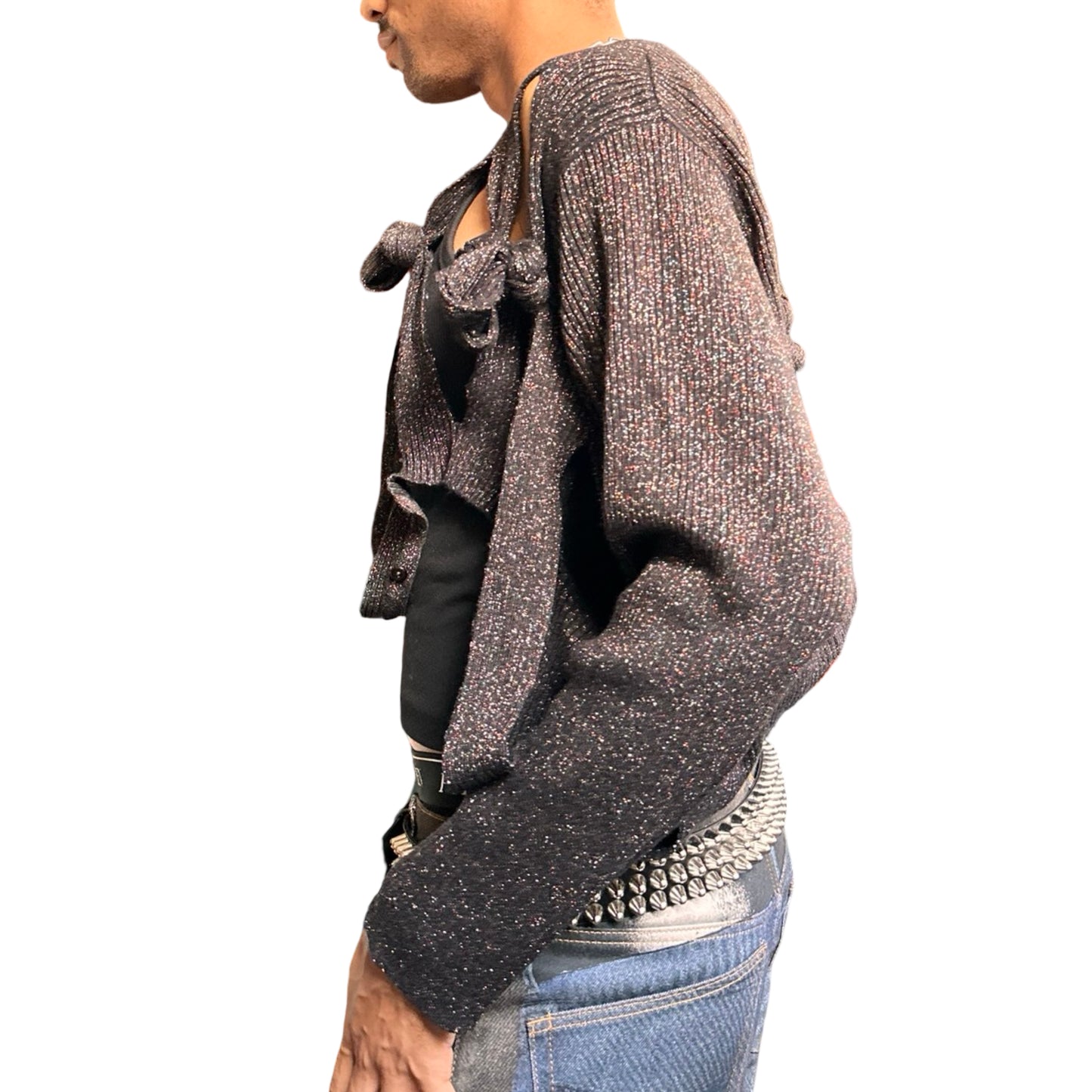 Left side of ASTROBOI* black modular rainbow lurex cardigan with cut outs, shimmer finish, and adjustable hanging straps for custom knot styling. Handmade in Brooklyn.