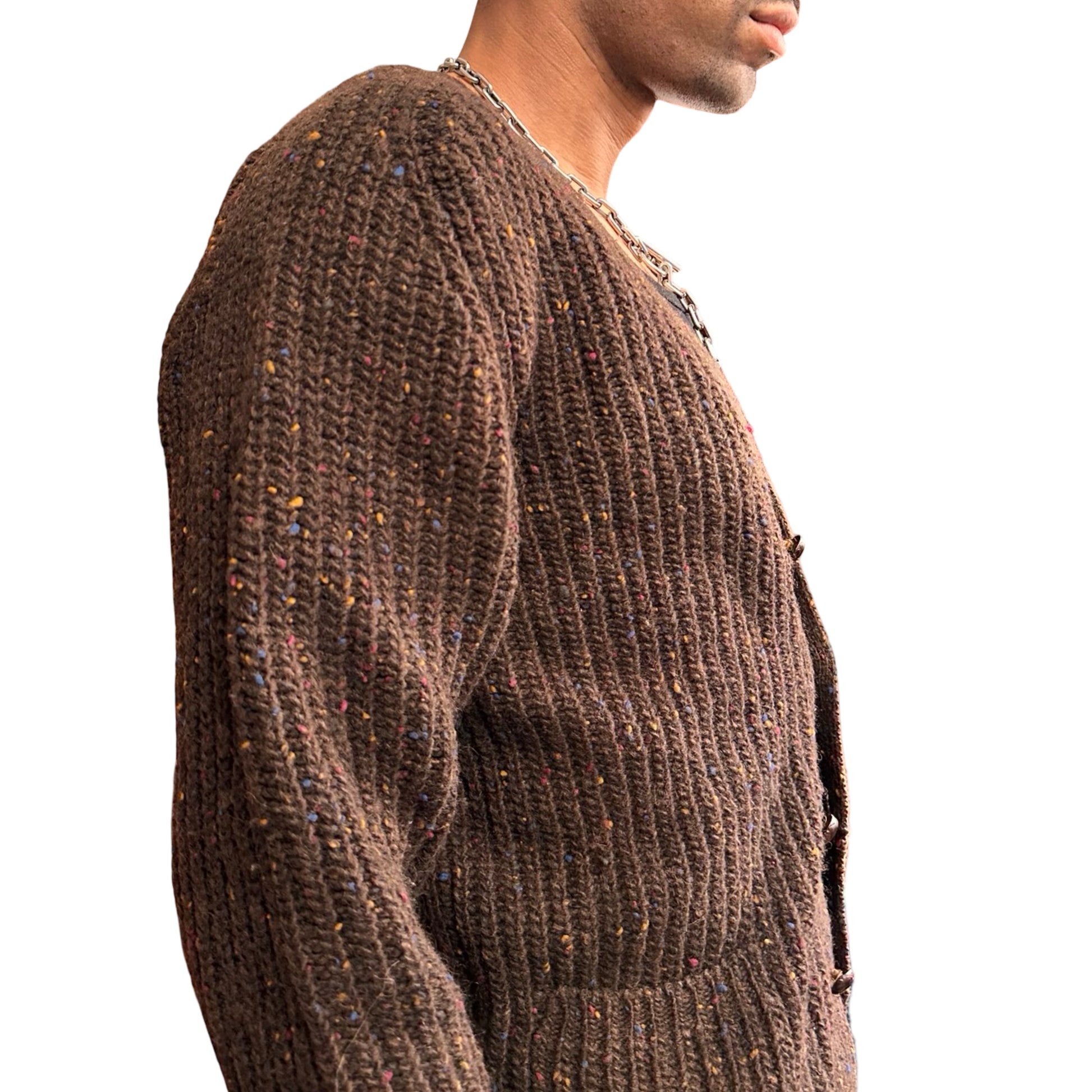 Brown knitted sweater worn by a person on a white background
