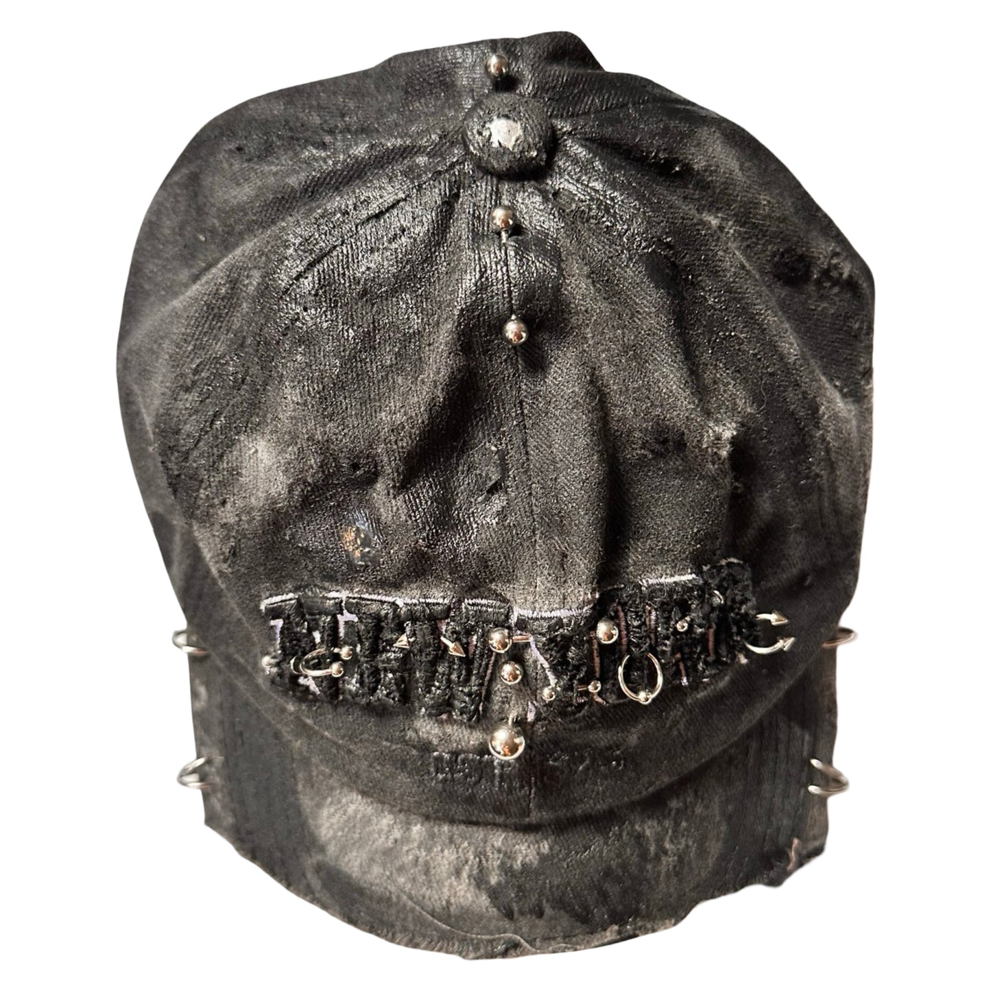 Flat top of Black half-visor “New York” hat with embroidered front logo, stainless steel piercings, and an adjustable strap.