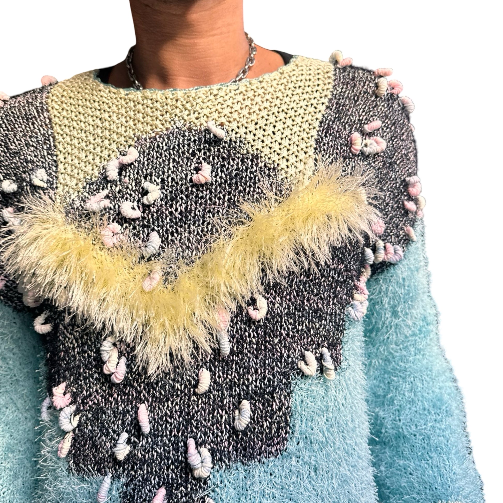 Vintage blue and yellow hand-knit granny sweater with crescent yarn accents and boxy cropped fit, size XL. Front close up 